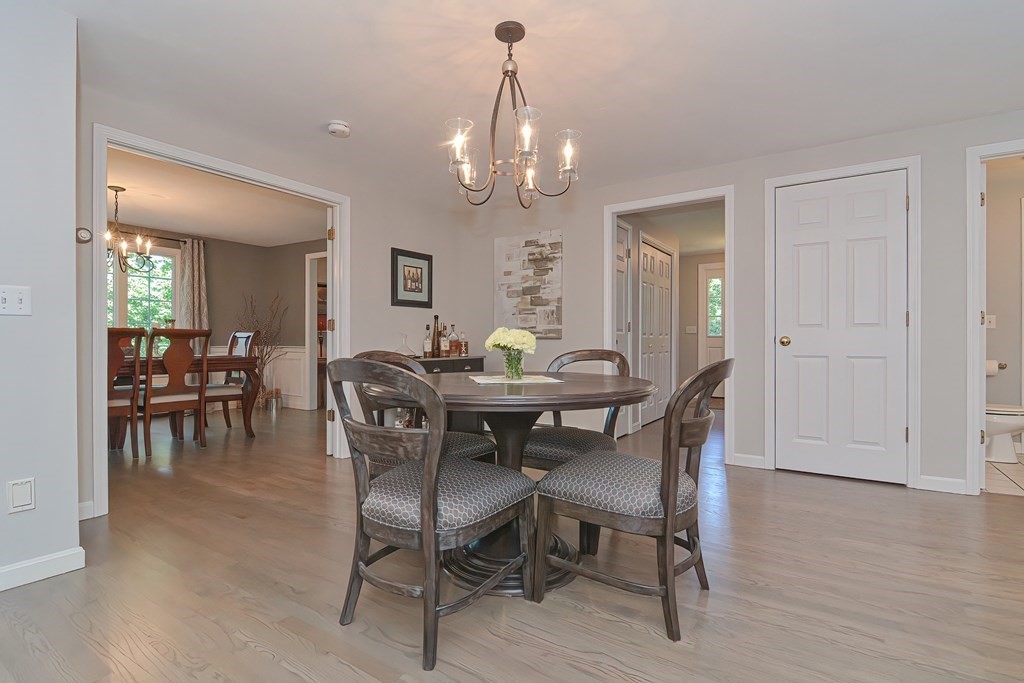 5 Tower Hill Drive Sandwich, MA 02563 - Photo 8 of 41 a view of a dining room with furniture and wooden floor