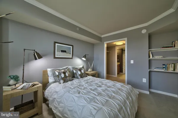 a bedroom with a bed and with furniture