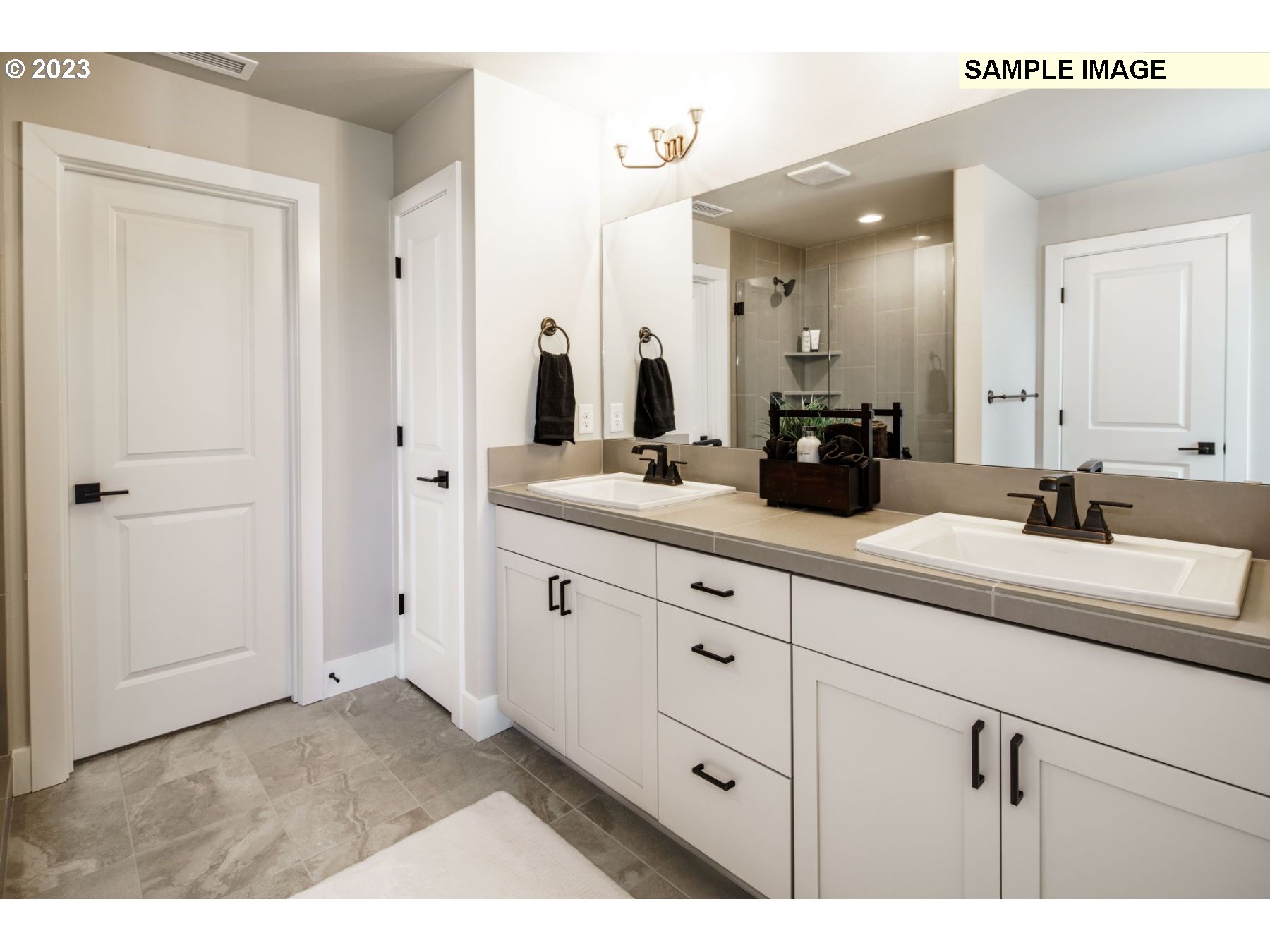 808 Northwest 178th Street Ridgefield, WA 98642 - Photo 16 of 21 a bathroom with a double vanity sink and mirror