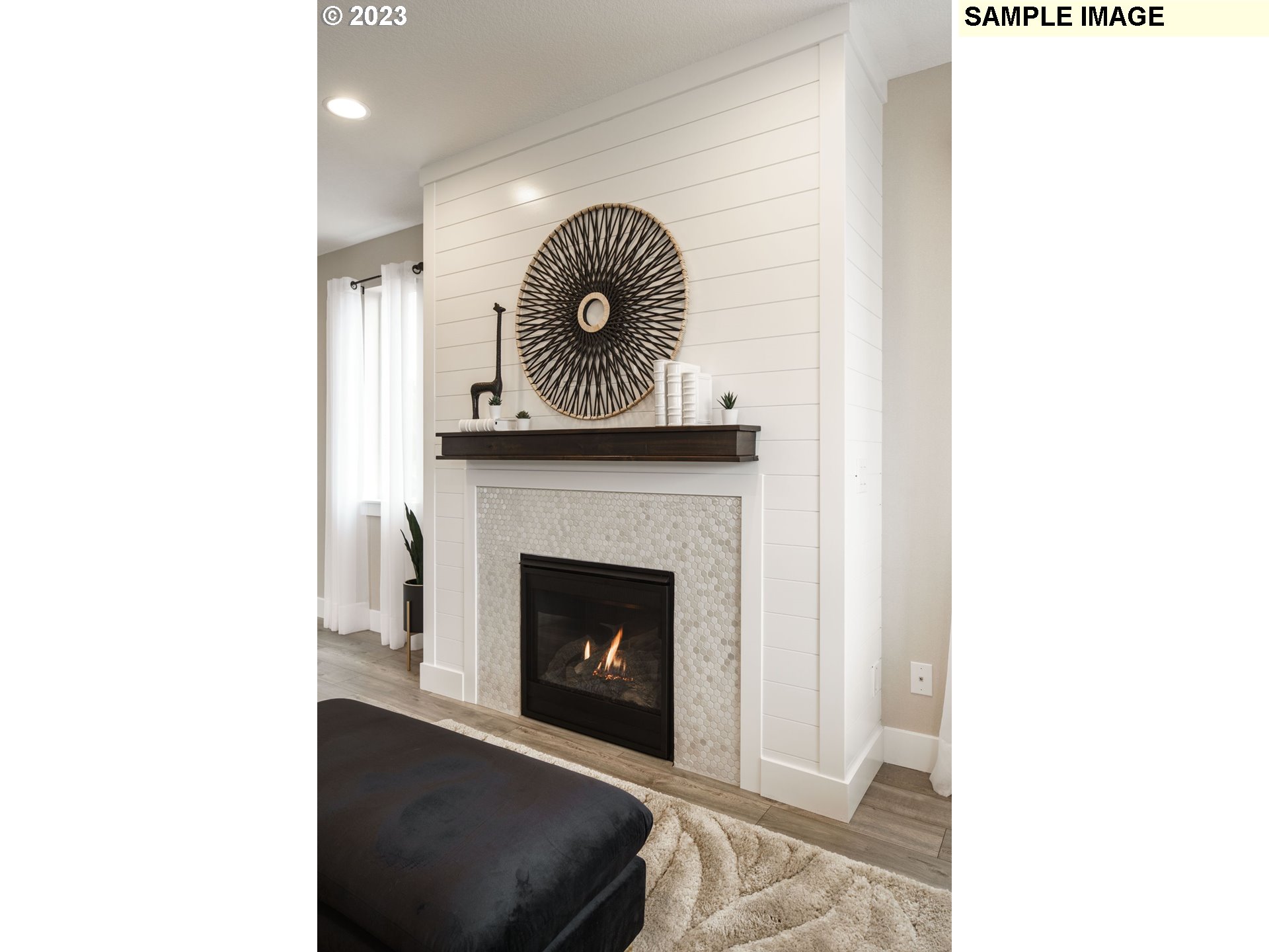 808 Northwest 178th Street Ridgefield, WA 98642 - Photo 10 of 21 a living room with a fireplace and a table
