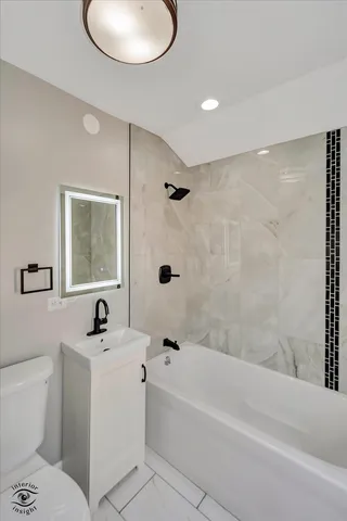 a bathroom with a sink a toilet and a bathtub