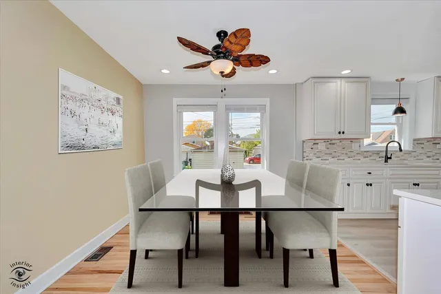 a view of a dining room with furniture and window