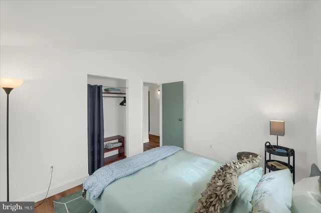 a bedroom with a bed and a table