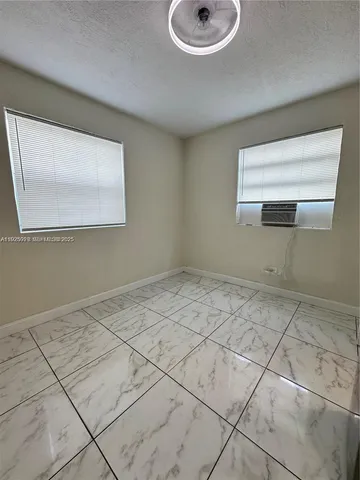 a view of a room with a sink and a window