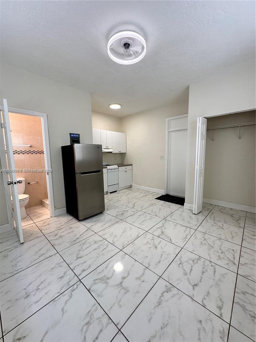 912 Northwest 9th Avenue, Unit 8 Hallandale Beach, FL 33009 - Photo 5 of 10 a view of a livingroom with a furniture