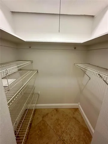 a view of a room with racks on the wall