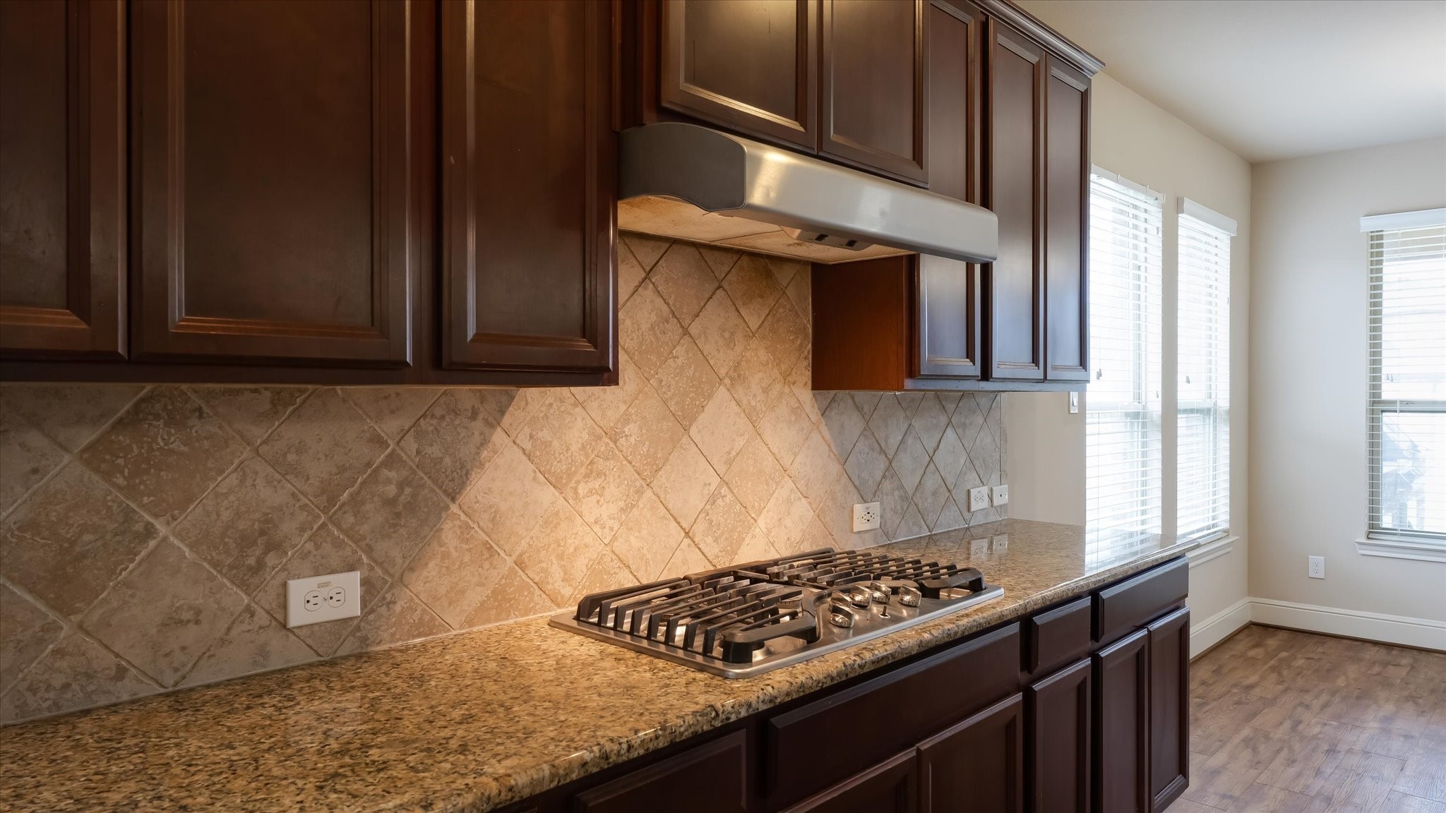 17211 Green Darter Conroe, TX 77385 - Photo 15 of 48 a kitchen with cabinets and a stove top oven