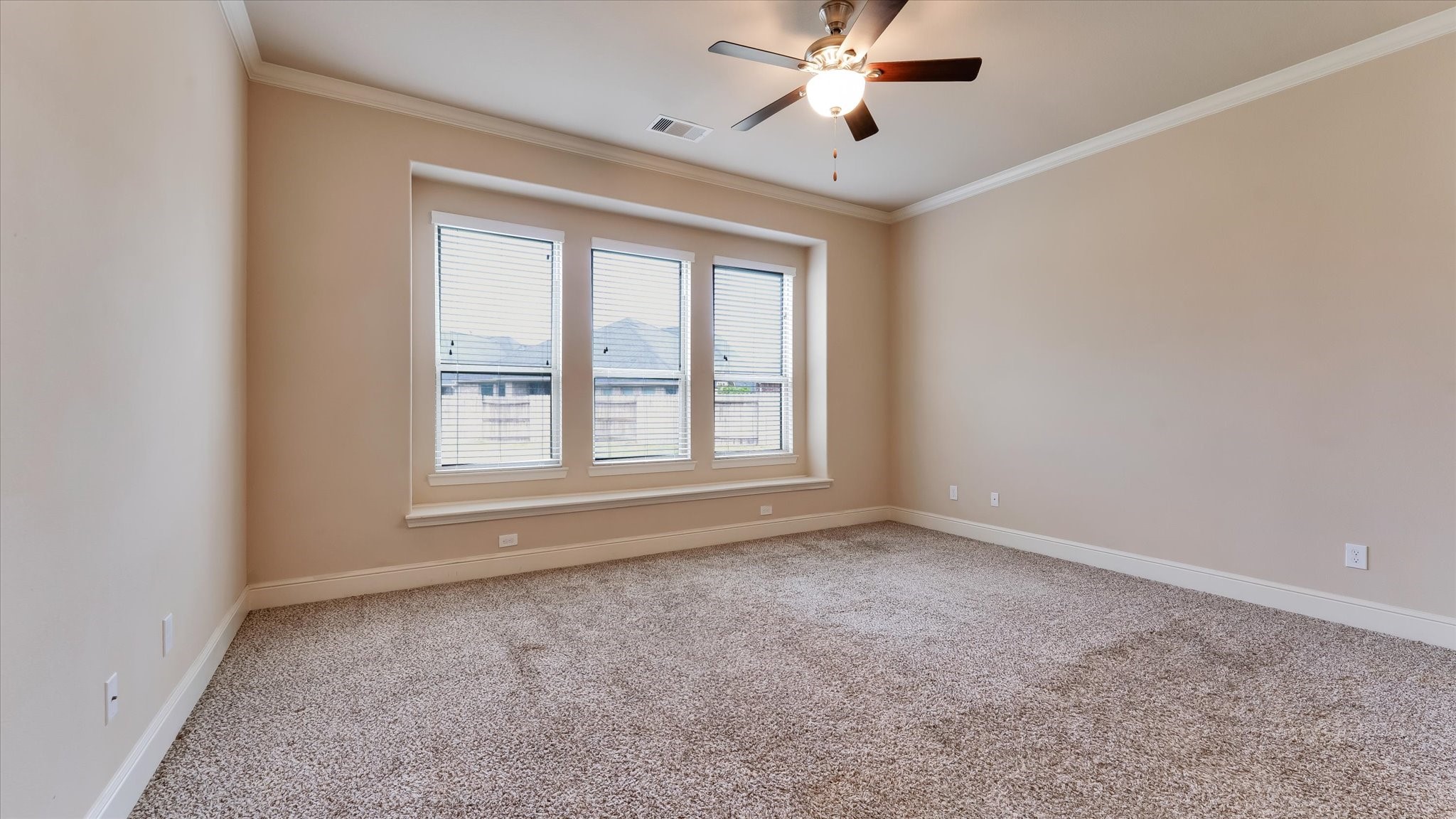 17211 Green Darter Conroe, TX 77385 - Photo 17 of 48 The primary suite has three large windows providing ample natural light, and a ceiling fan