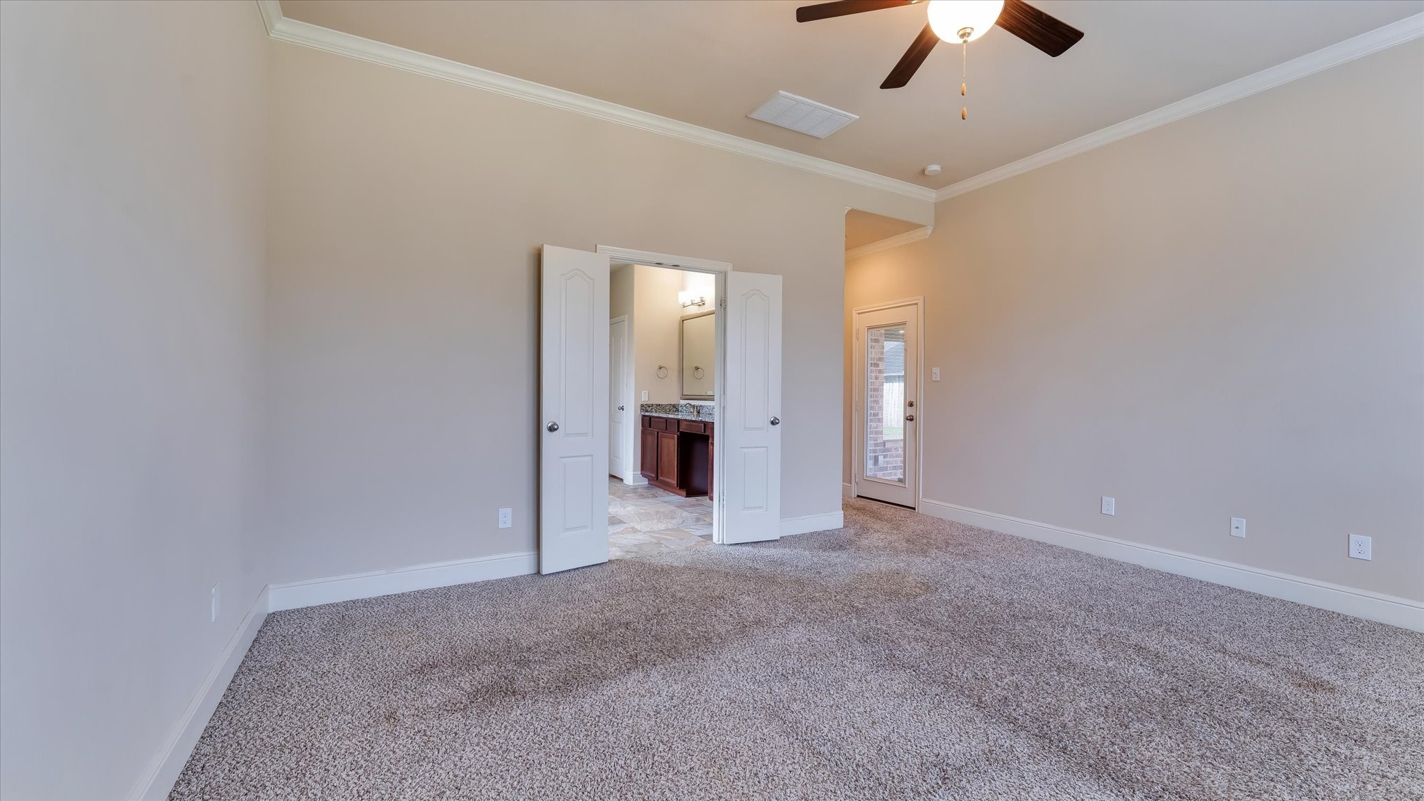 17211 Green Darter Conroe, TX 77385 - Photo 18 of 48 Another view of the primary suite with crown molding for an elegant touch.