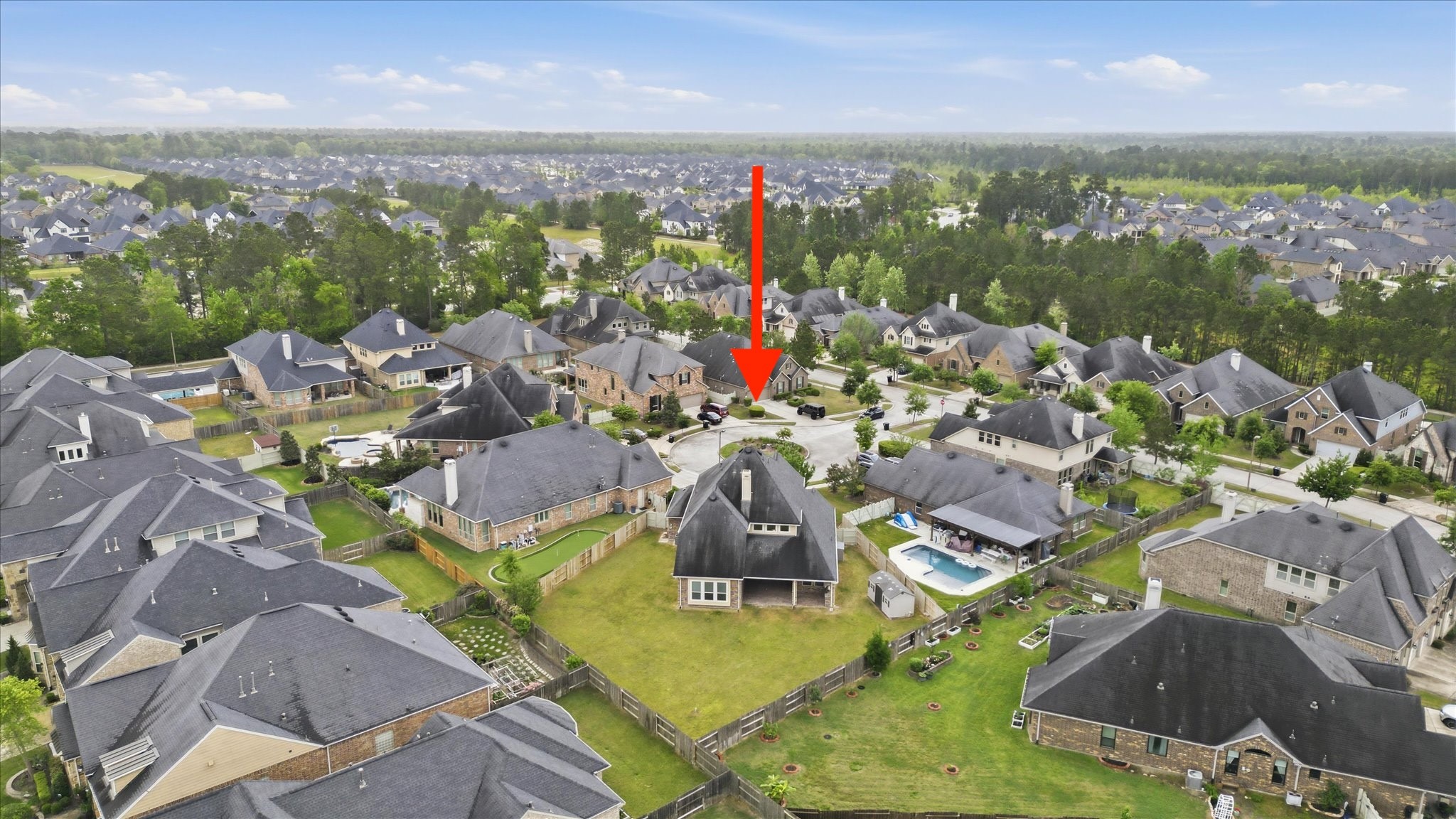 17211 Green Darter Conroe, TX 77385 - Photo 2 of 48 The home is situated on a cul-de-sac with a large backyard, surrounded by other well-maintained properties and greenery. Quiet and family-friendly atmosphere.