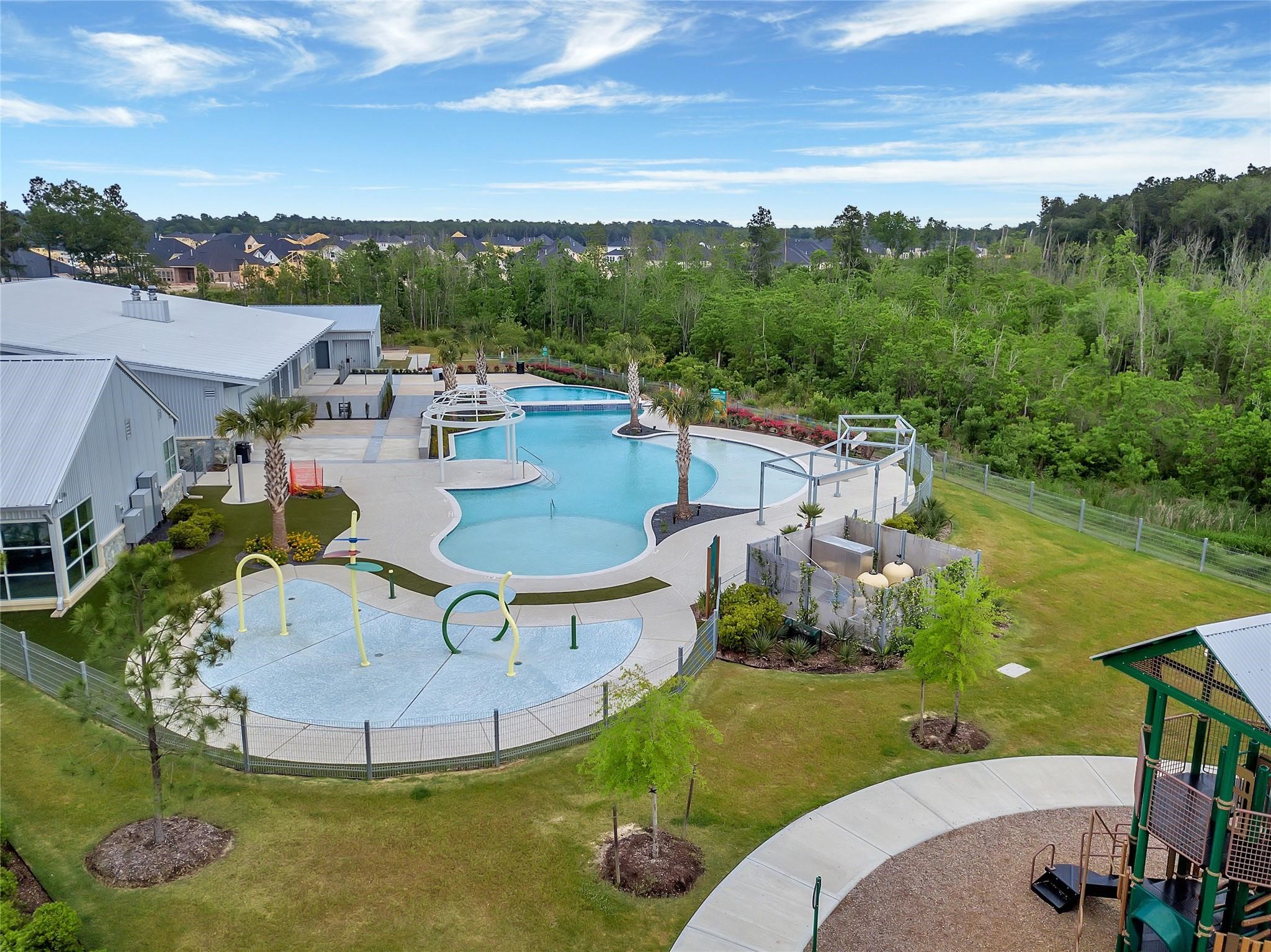 17211 Green Darter Conroe, TX 77385 - Photo 38 of 48 a view of a swimming pool with a table and chairs