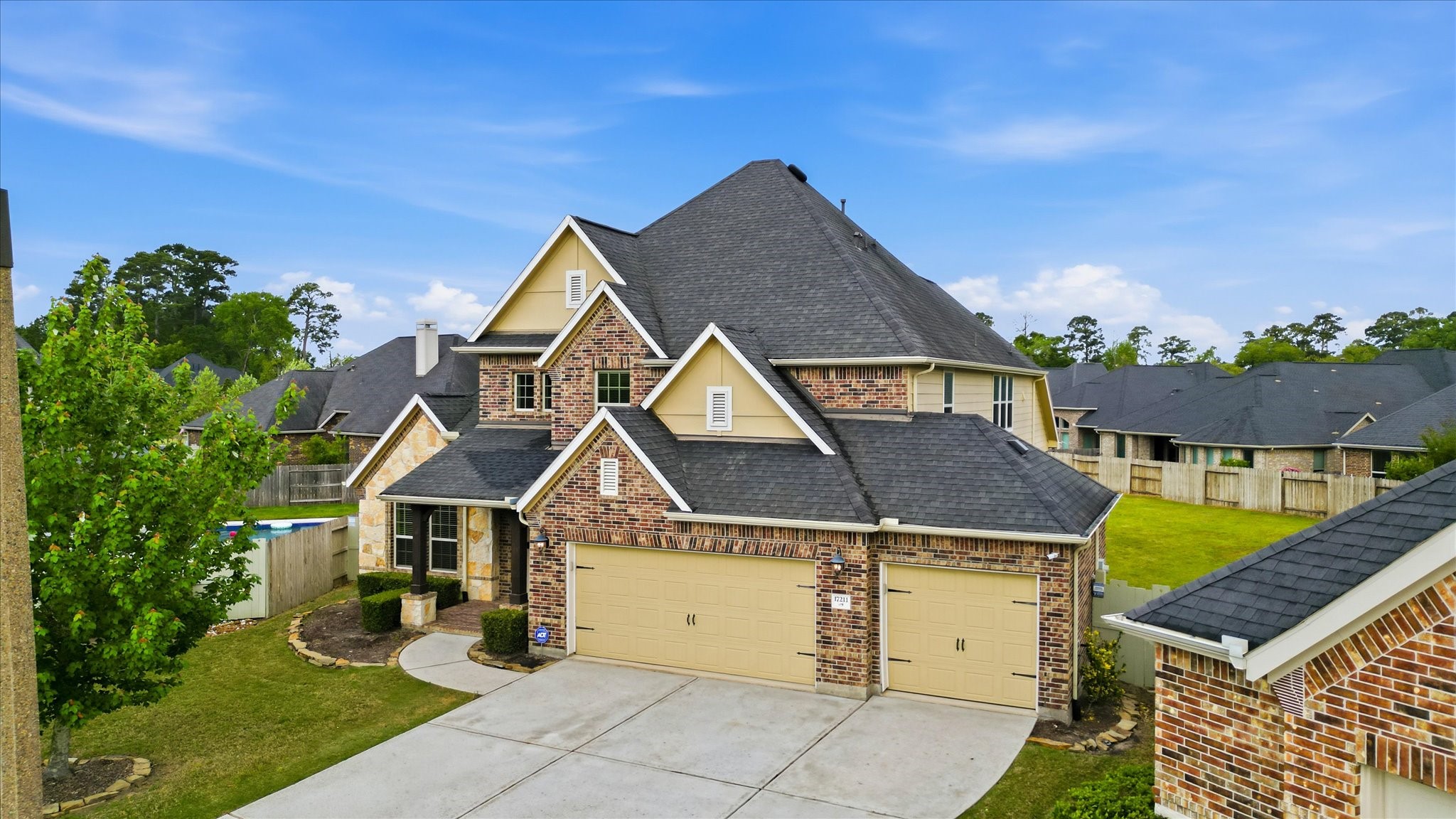 17211 Green Darter Conroe, TX 77385 - Photo 5 of 48 The property features brick, stone, & stucco elevation and a three-car garage