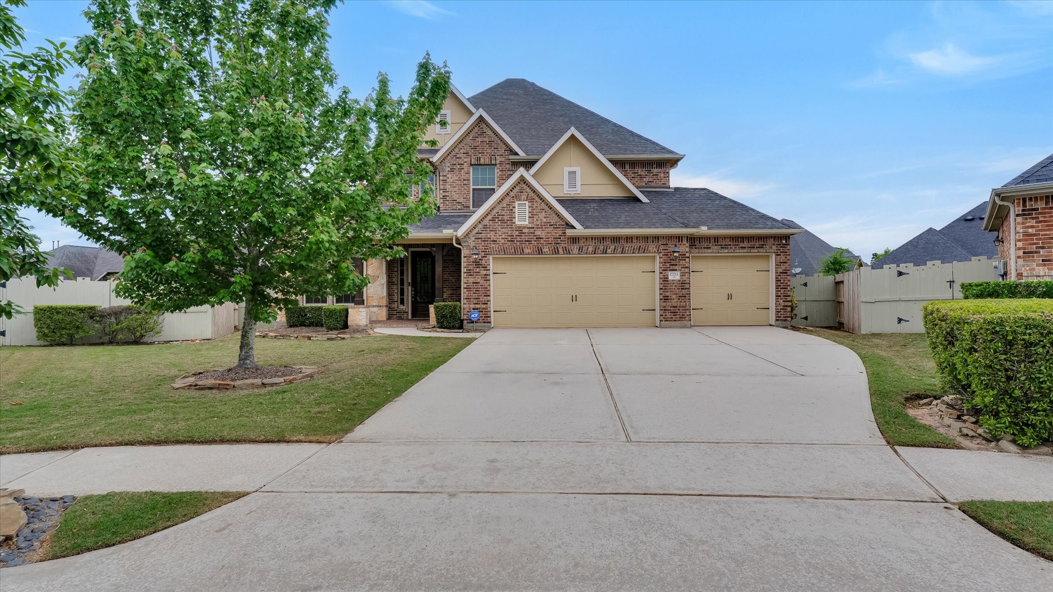 17211 Green Darter Conroe, TX 77385 - Photo 6 of 48 a front view of a house with a yard
