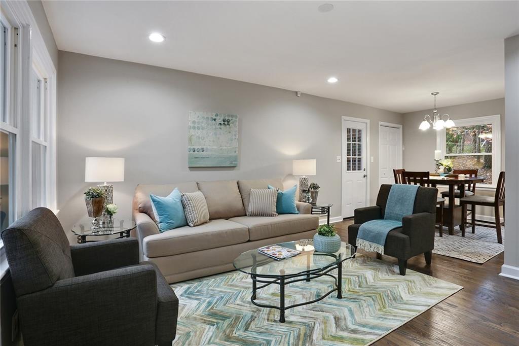 2980 Pasadena Drive Decatur, GA 30032 - Photo 1 of 1 a living room with furniture and wooden floor
