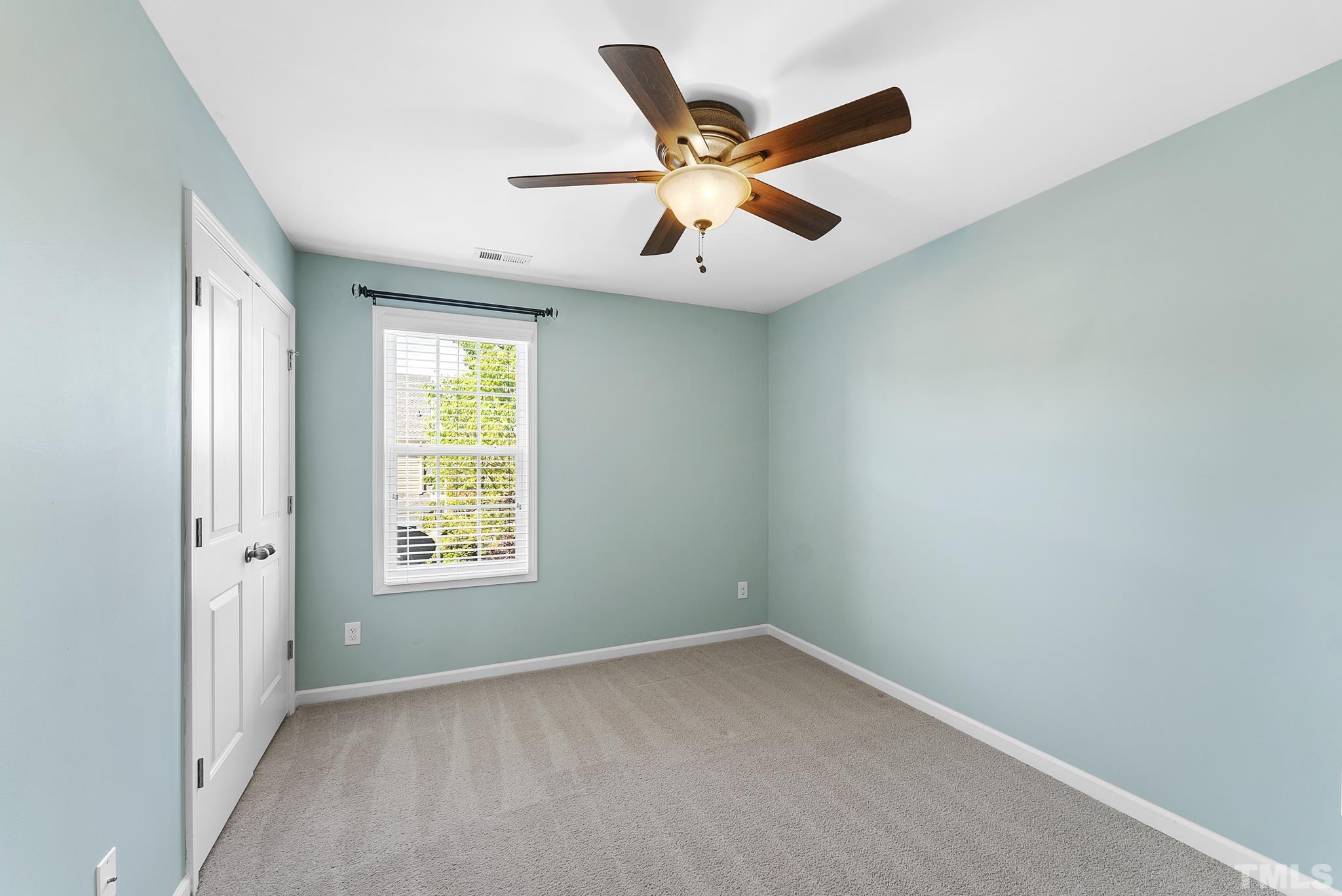 517 Dragby Lane Raleigh, NC 27603 - Photo 17 of 31 an empty room with windows and fan