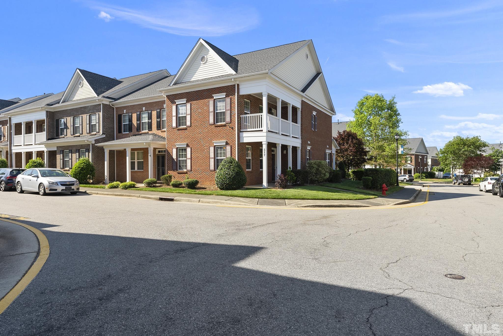 517 Dragby Lane Raleigh, NC 27603 - Photo 2 of 31 a city street lined with buildings and trees