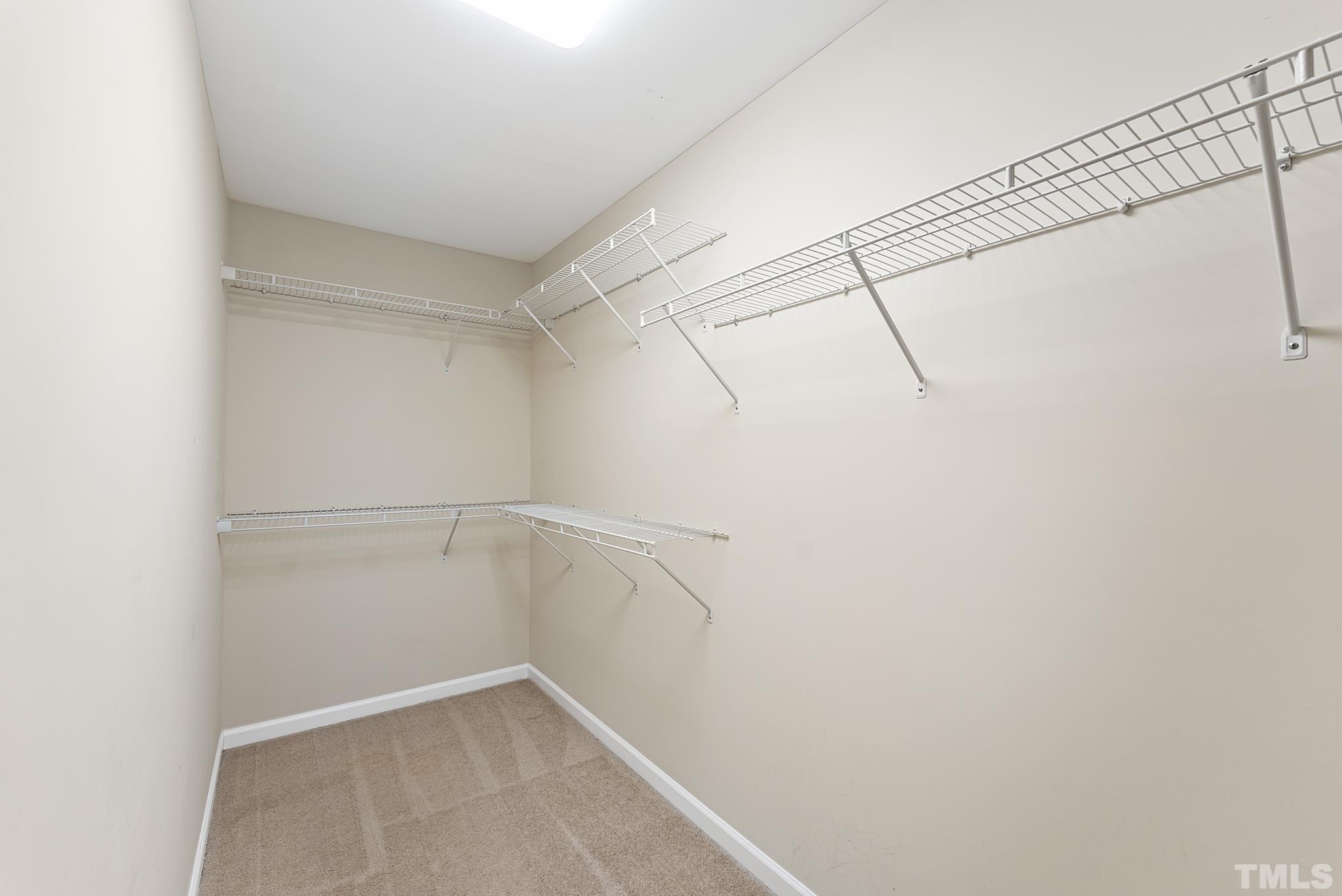 517 Dragby Lane Raleigh, NC 27603 - Photo 26 of 31 a view of a room with racks on the wall