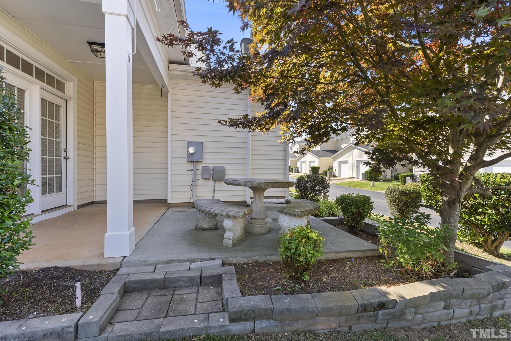 517 Dragby Lane Raleigh, NC 27603 - Photo 29 of 31 a view of a patio with table and chairs and potted plants