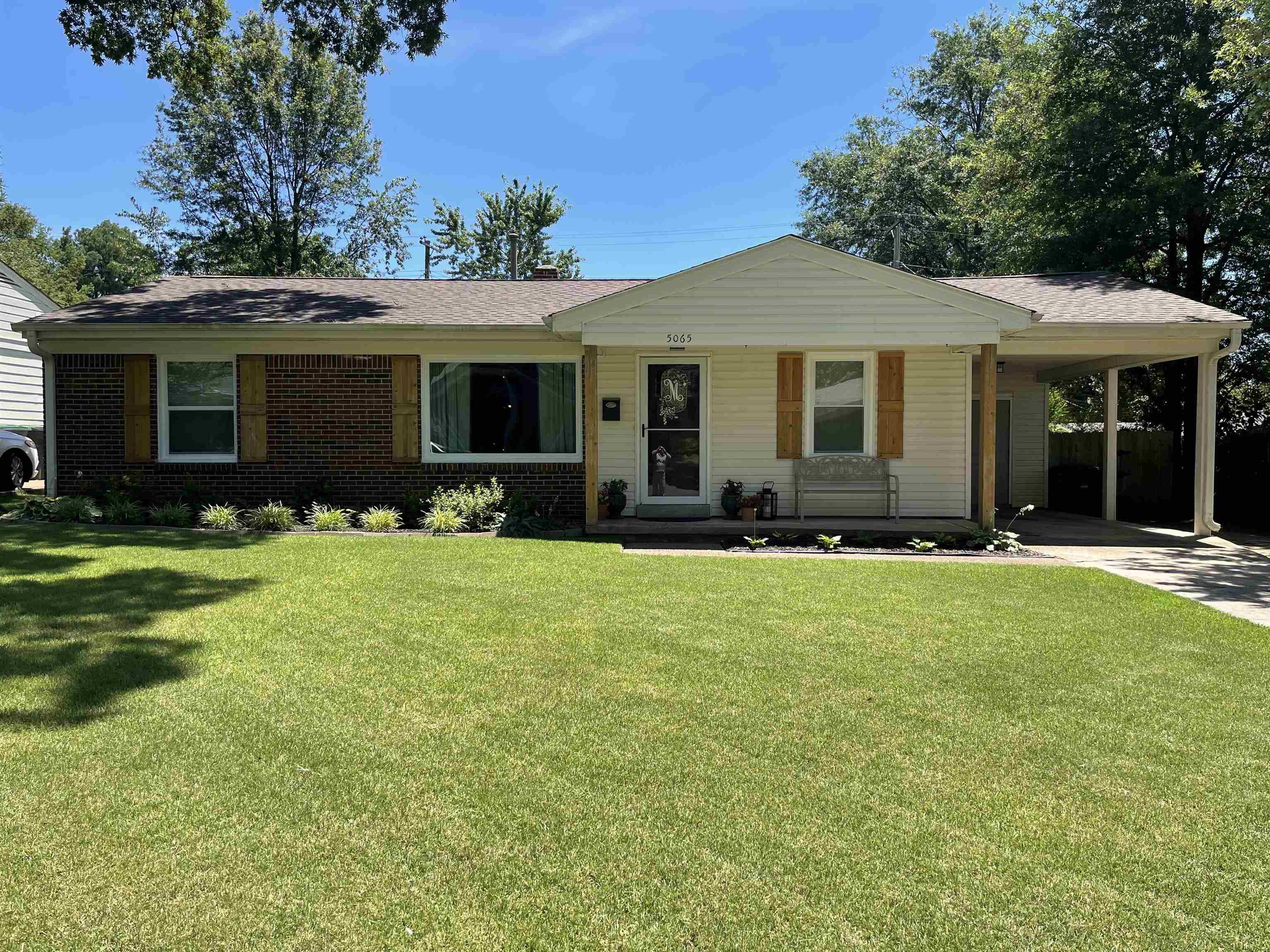 5065 Flamingo Road Memphis, TN 38117 - Photo 1 of 18 a front view of house with yard and green space