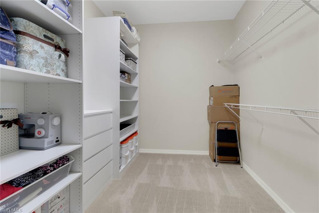 14645 Sutherland Avenue, Unit 87 Naples, FL 34119 - Photo 17 of 38 Master closet with custom shelving.