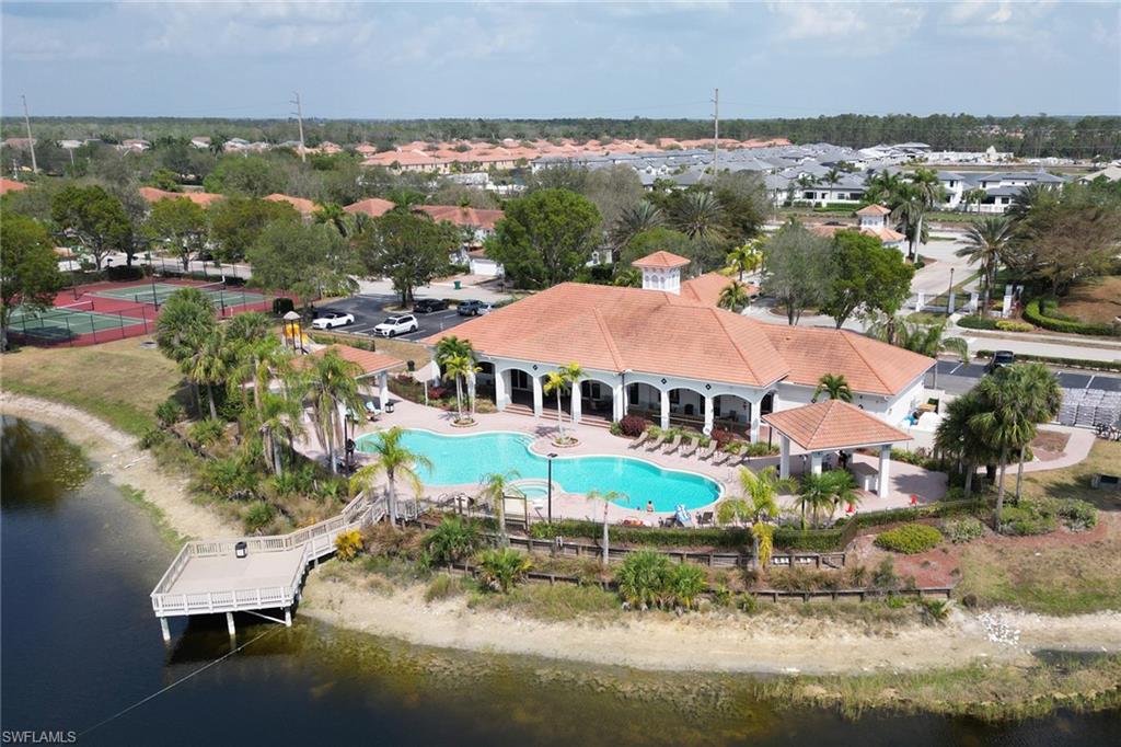 14645 Sutherland Avenue, Unit 87 Naples, FL 34119 - Photo 27 of 38 Resort-style pool and fishing pier