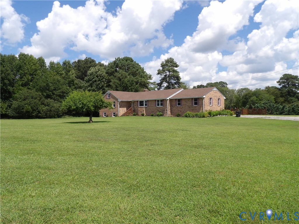 3813 Johnson Road Petersburg, VA 23805 - Photo 1 of 51 Brick-faced residence with a brown shingle roof, s