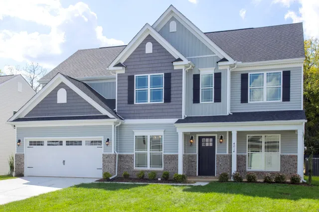 front view of a house with a yard