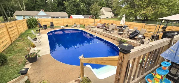 a view of a swimming pool with a patio