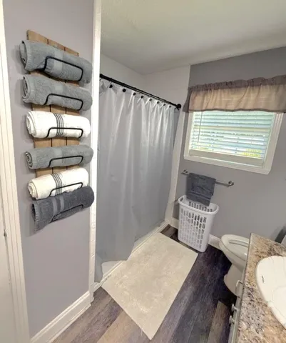 a bedroom with a bed and a chair