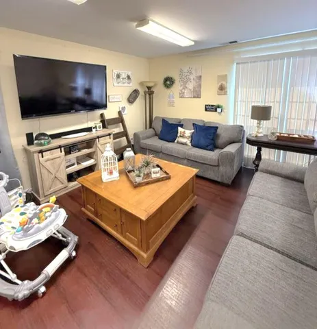 a bathroom with a granite countertop sink mirror and a bathtub