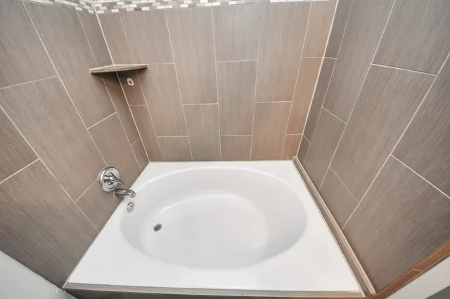 a bathroom with a white bath tub