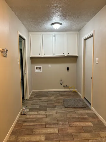 a view of kitchen with wooden floor
