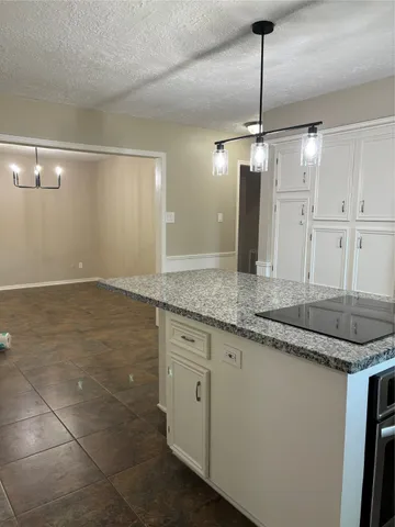 a kitchen with stainless steel appliances granite countertop a sink and cabinets