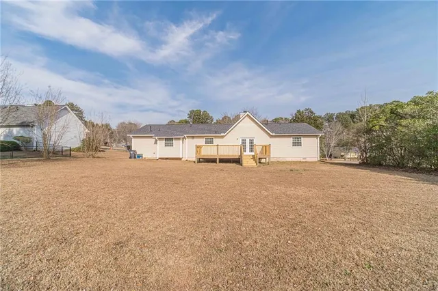 a view of a outdoor space with wooden fence