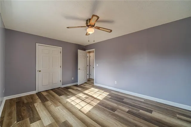 a view of room with window and ceiling fan