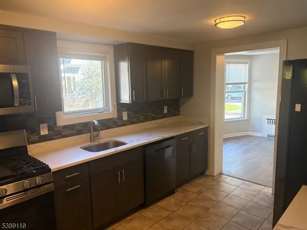 a kitchen with a sink and a window
