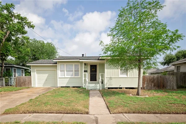 front view of a house with a yard