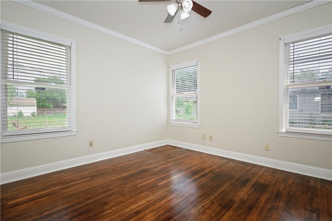 726 Anderson Street Corpus Christi, TX 78411 - Photo 15 of 19 a view of empty room with wooden floor and fan