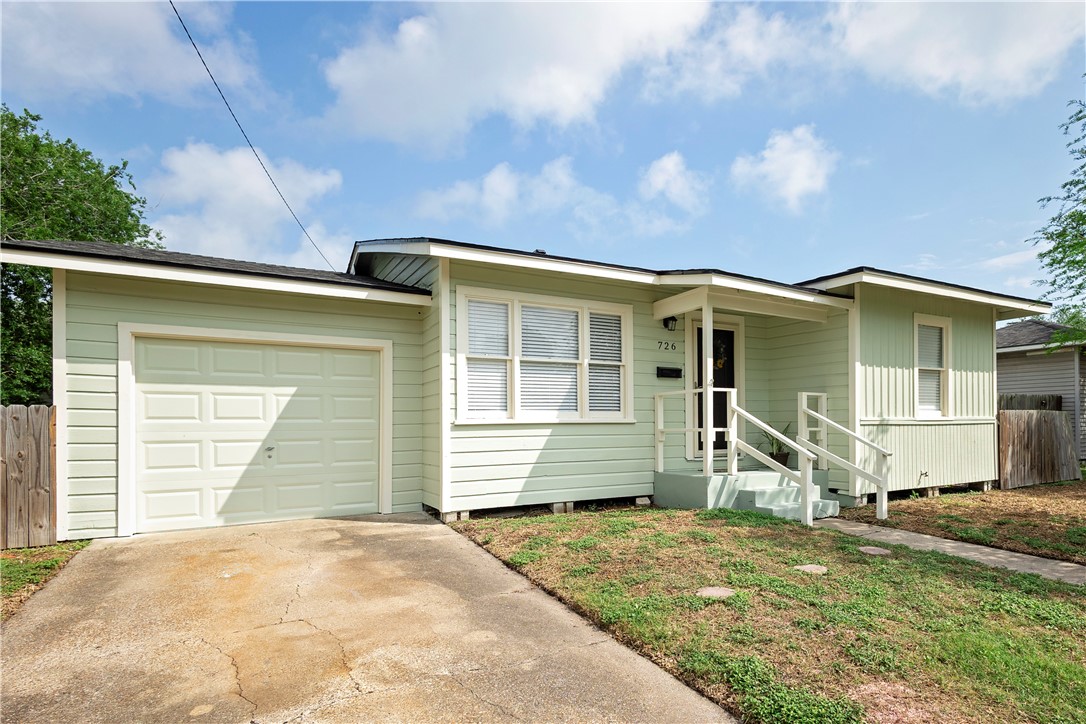 726 Anderson Street Corpus Christi, TX 78411 - Photo 2 of 19 a front view of a house with a yard