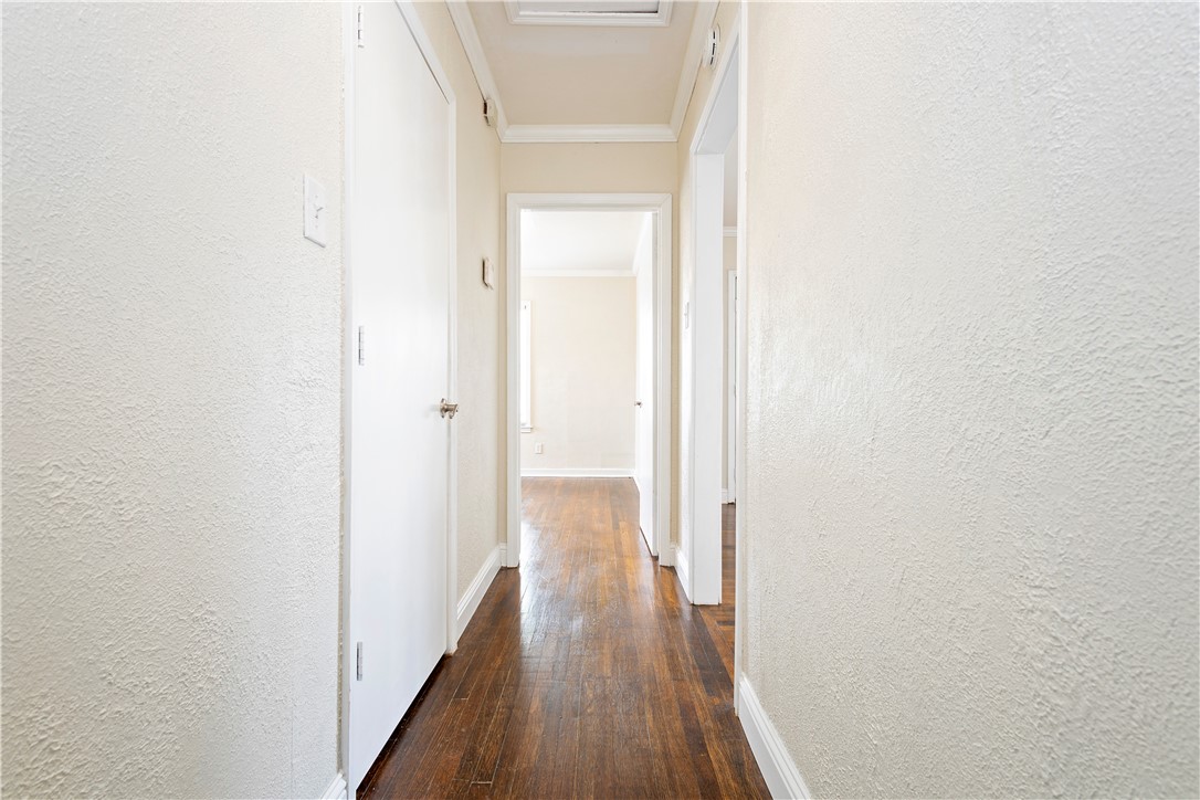 726 Anderson Street Corpus Christi, TX 78411 - Photo 9 of 19 a view of a hallway with wooden floor