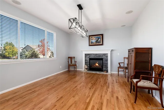 a view of a livingroom with furniture and a fireplace