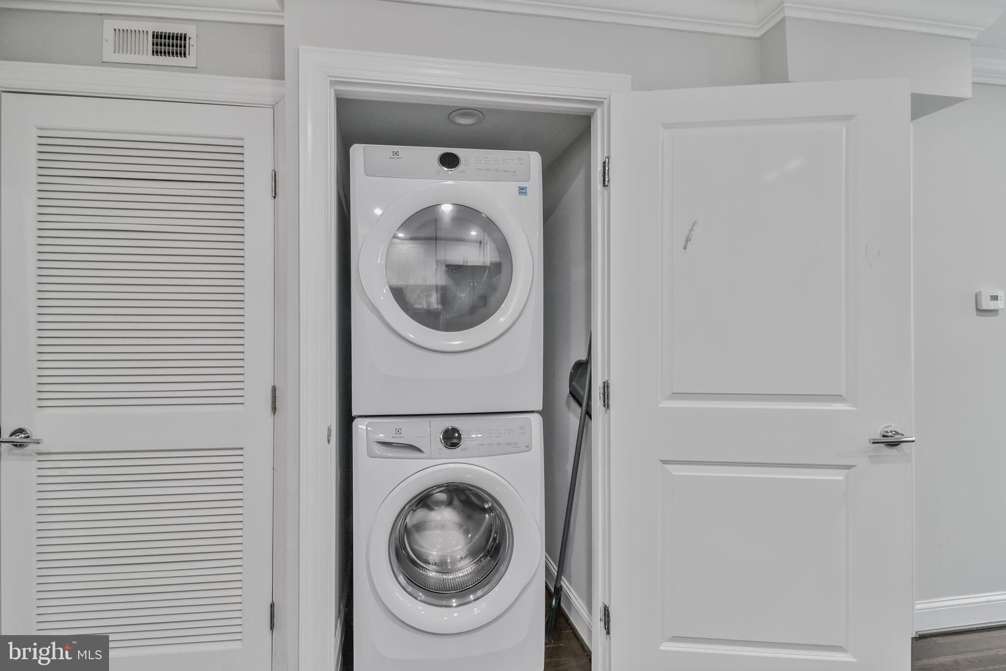1423 Howard Road Southeast Washington, DC 20020 - Photo 18 of 45 a view of a hallway with washer and dryer
