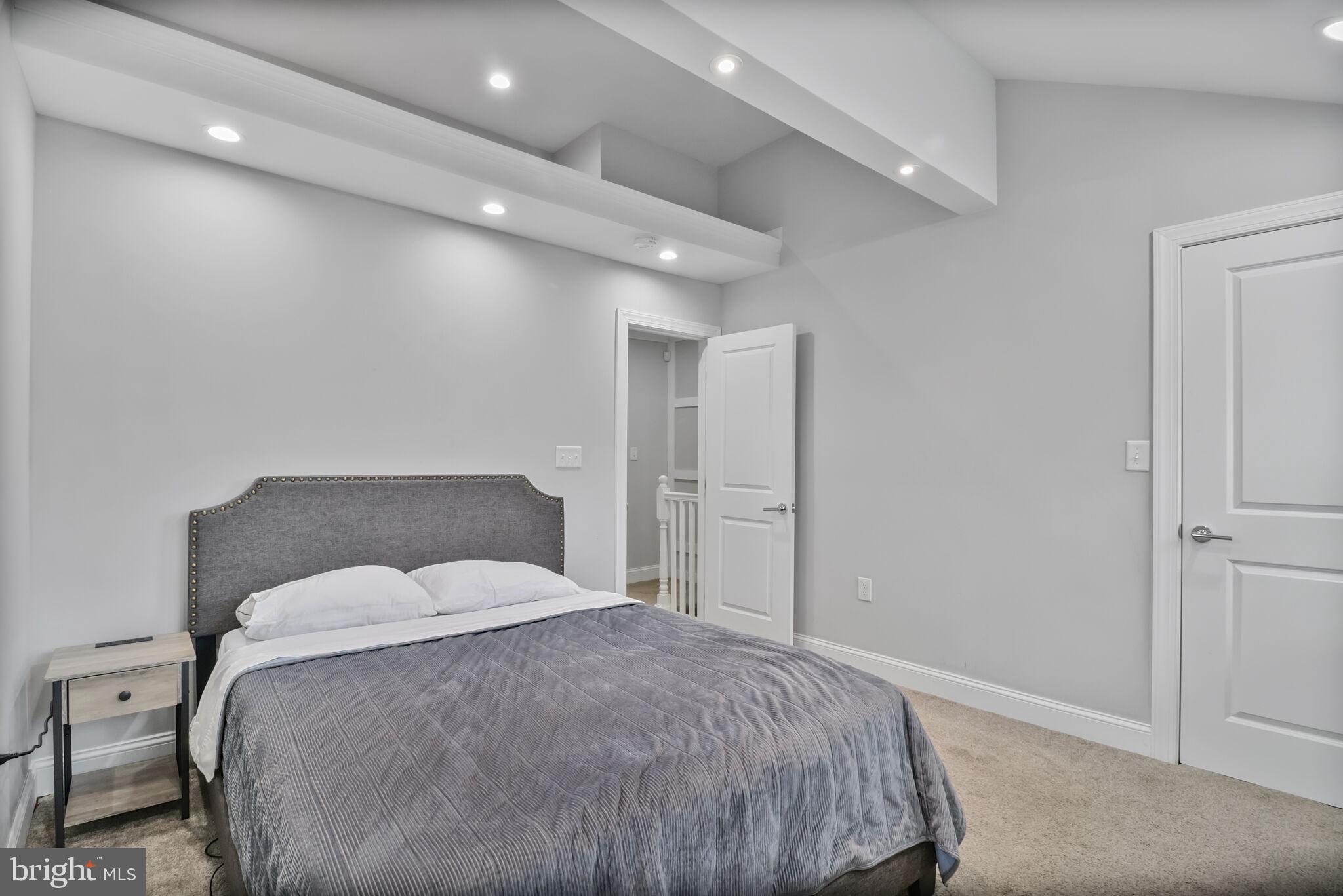 1423 Howard Road Southeast Washington, DC 20020 - Photo 21 of 45 a bedroom with a bed and a night stand