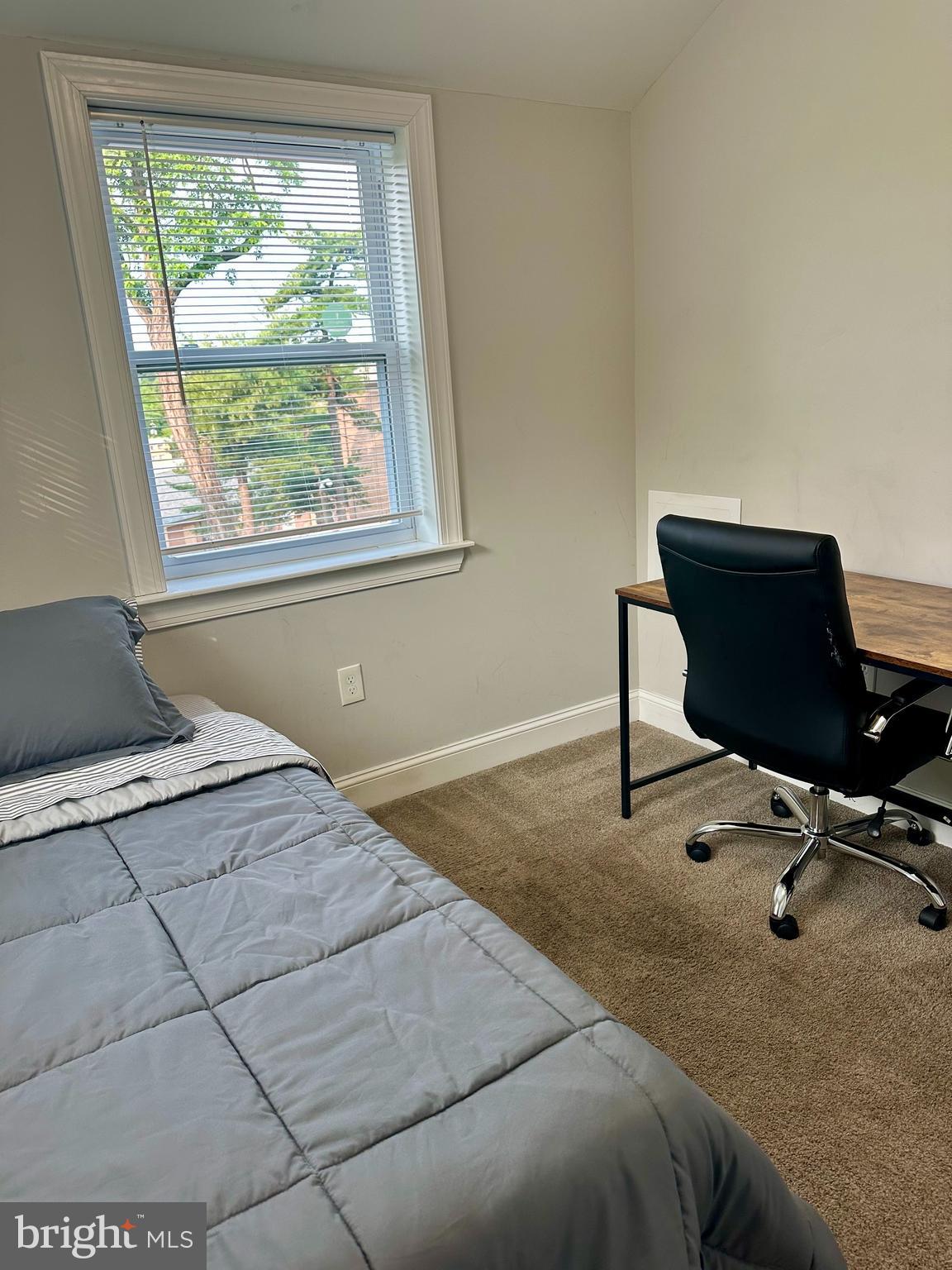 1423 Howard Road Southeast Washington, DC 20020 - Photo 28 of 45 a bedroom with a bed and a desk