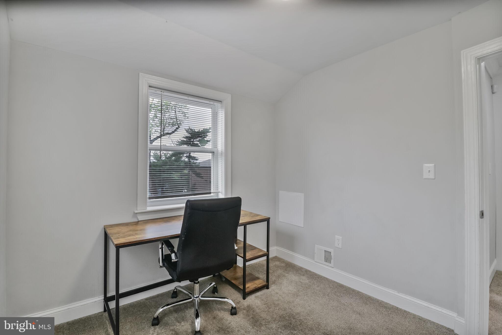 1423 Howard Road Southeast Washington, DC 20020 - Photo 29 of 45 a workspace with furniture and a window