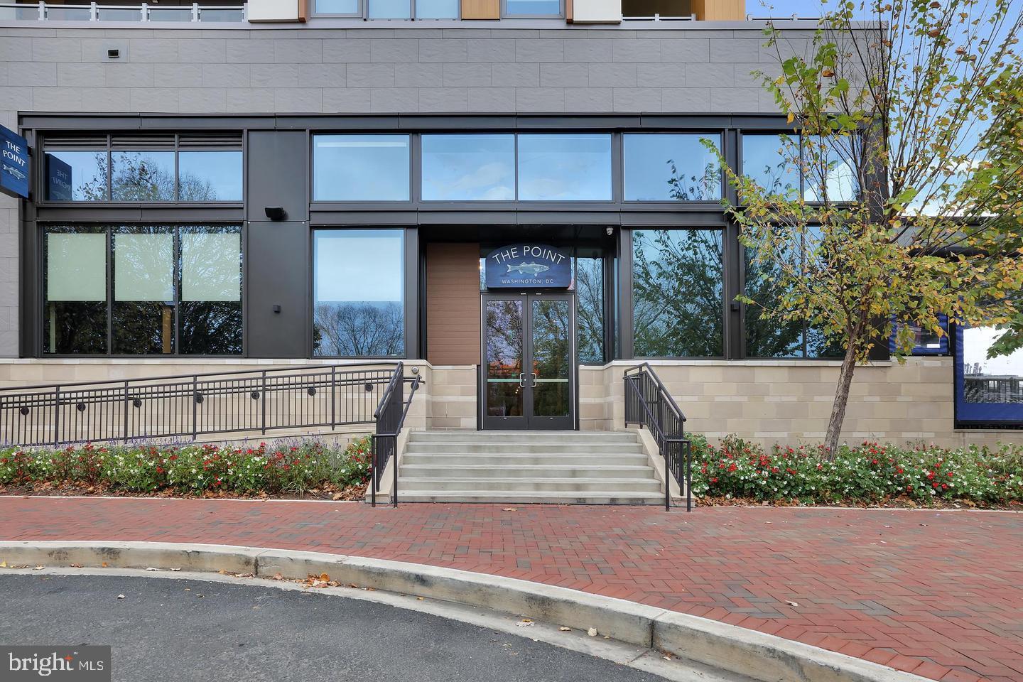 1423 Howard Road Southeast Washington, DC 20020 - Photo 43 of 45 a view of a brick house with large windows and plants