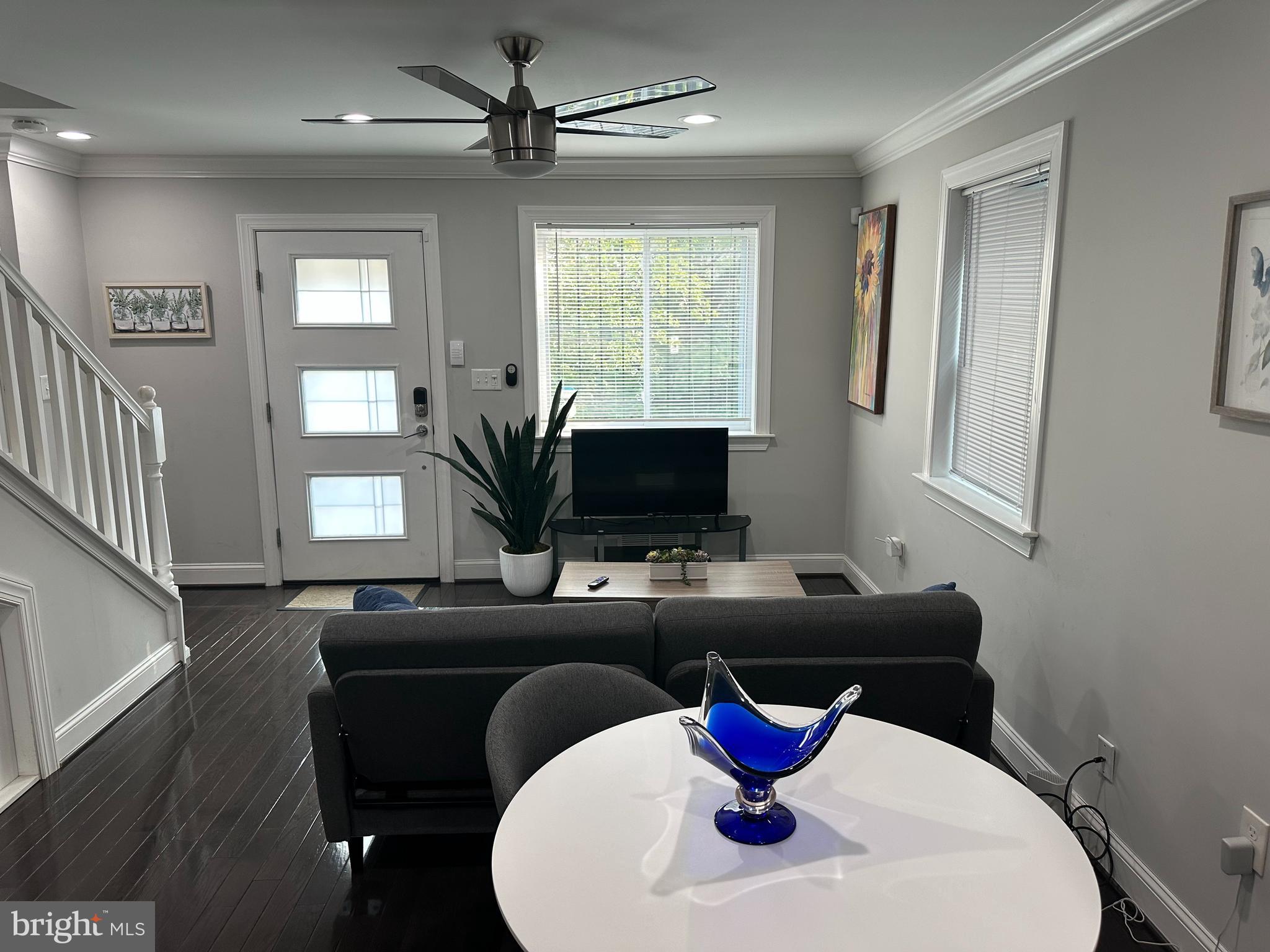 1423 Howard Road Southeast Washington, DC 20020 - Photo 5 of 45 a living room with furniture a window and a flat screen tv