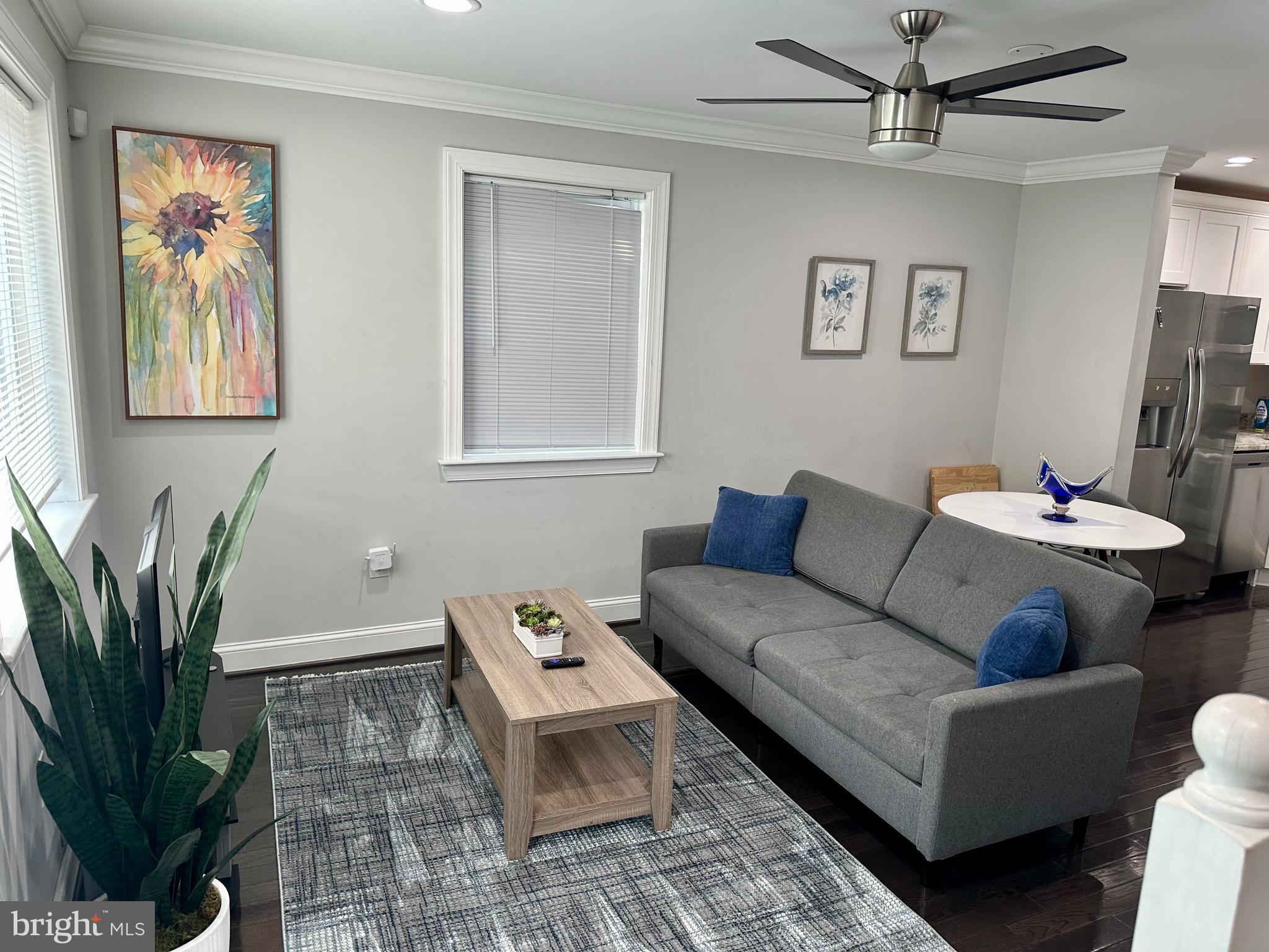 1423 Howard Road Southeast Washington, DC 20020 - Photo 6 of 45 a living room with furniture potted plant and a window