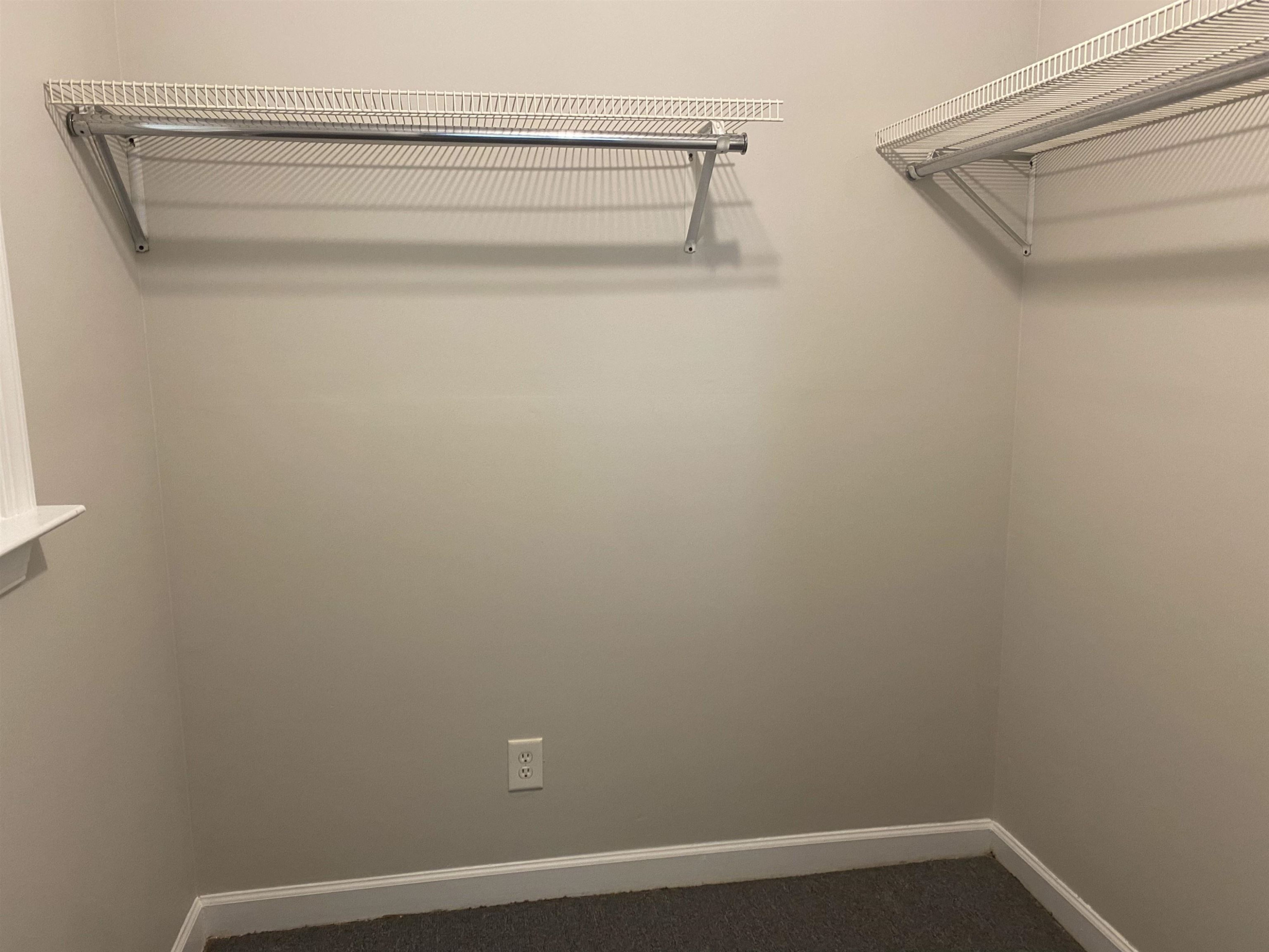 633 Buck Jones Road Raleigh, NC 27606 - Photo 14 of 20 a view of a room with rack on the wall
