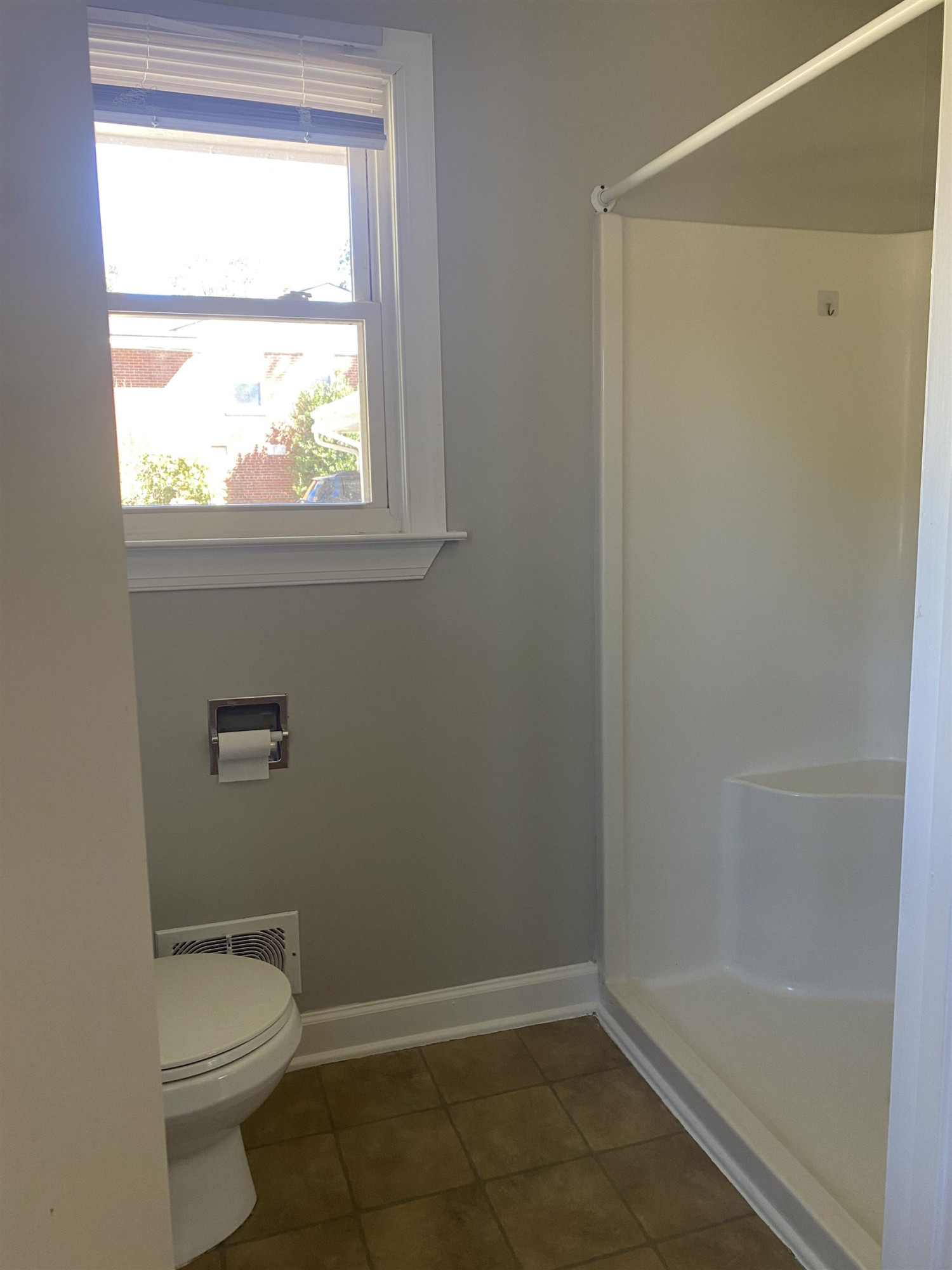633 Buck Jones Road Raleigh, NC 27606 - Photo 17 of 20 a bathroom with a granite countertop toilet a sink and a shower